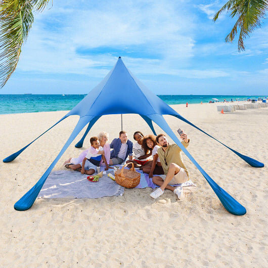 Blue 20x20 beach canopy tent with UPF50 sun protection, sandbags, and aluminum poles setup outdoors — view 5