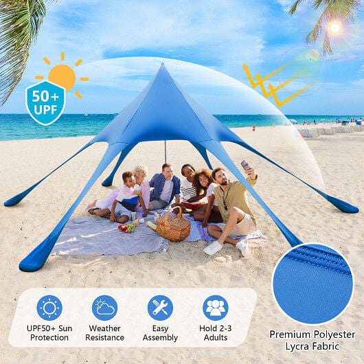 Blue 20x20 beach canopy tent with UPF50 sun protection, sandbags, and aluminum poles setup outdoors — view 4