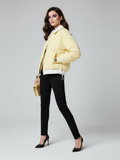 Pastel yellow women's tweed jacket with large gold buttons and a tailored cropped silhouette