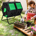 Black and green dual chamber rotating compost tumbler on a sturdy powder-coated metal frame.