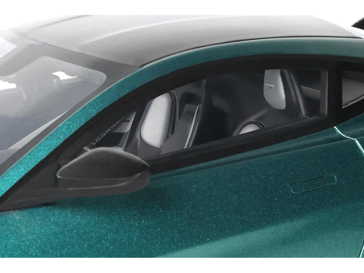 1/18 scale Aston Martin Vantage V12 model car in British Racing Green with black hood — view 4