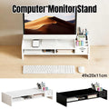 Multi-function computer monitor riser stand with side caddy and open storage shelf on a desk