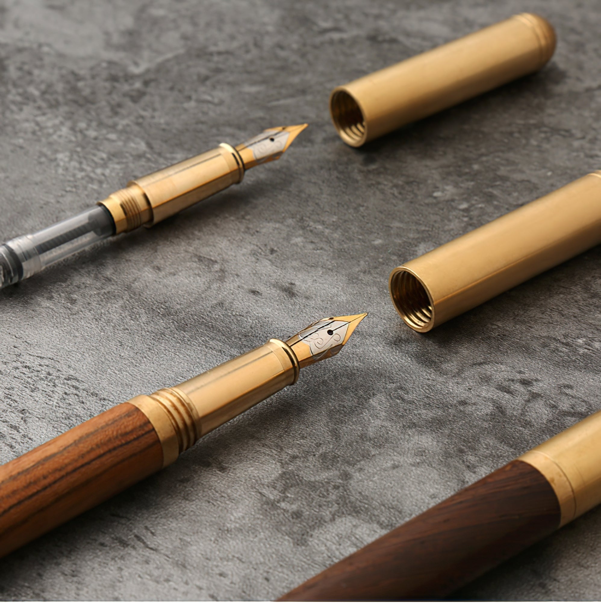 Handcrafted solid wood and brass fountain pen with a fine iridium nib on a desk — view 2
