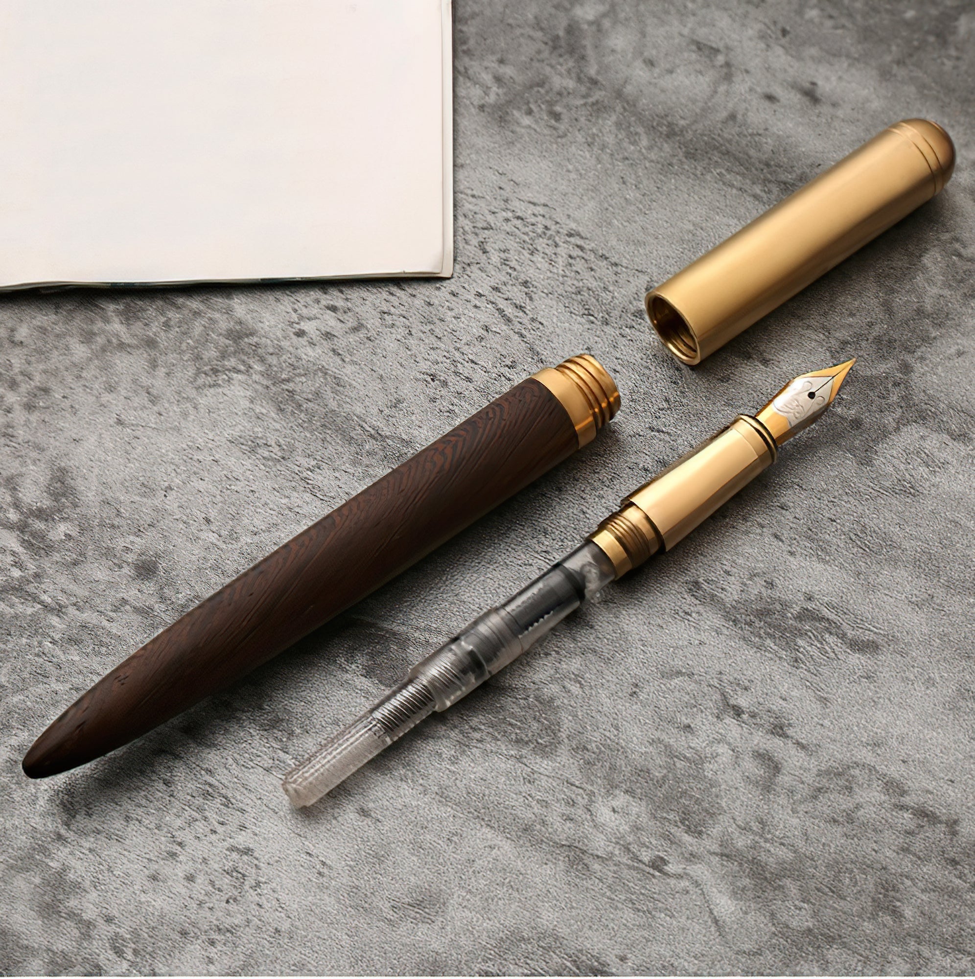 Handcrafted solid wood and brass fountain pen with a fine iridium nib on a desk — view 4