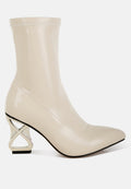 Gaias patent faux leather boots with pointed toe, metallic fantasy heels, and zipper closure.