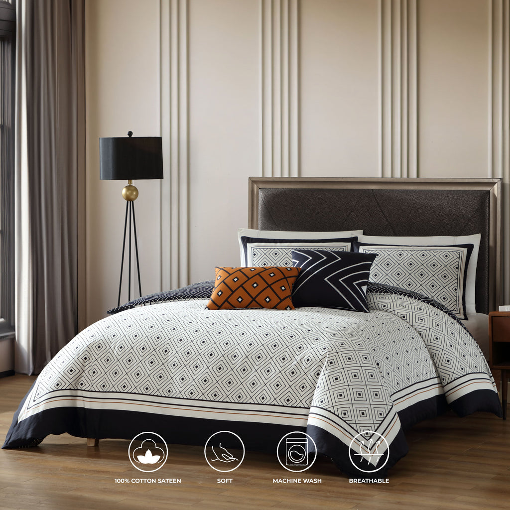 Black and white geometric reversible cotton comforter set with shams and decorative pillows on bed — view 2