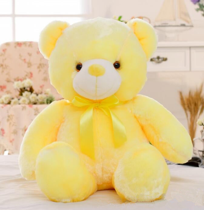 Glowing soft plush teddy bear emitting colorful LED light, a soothing night time toy for children
