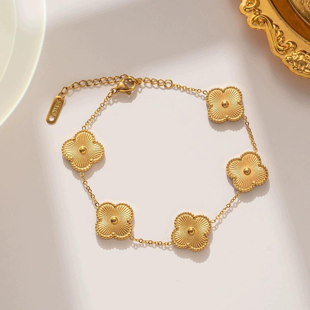 Golden clover flower charm bracelet with a radiant gold finish and delicate adjustable chain — view 2