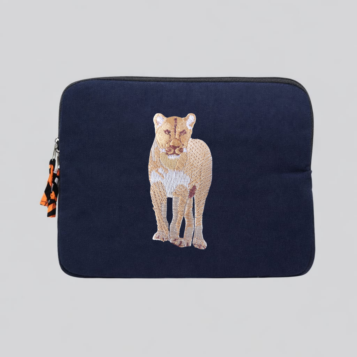 Lion laptop sleeve in handmade cotton canvas with intricate wildlife embroidery and protective padding. — view 2