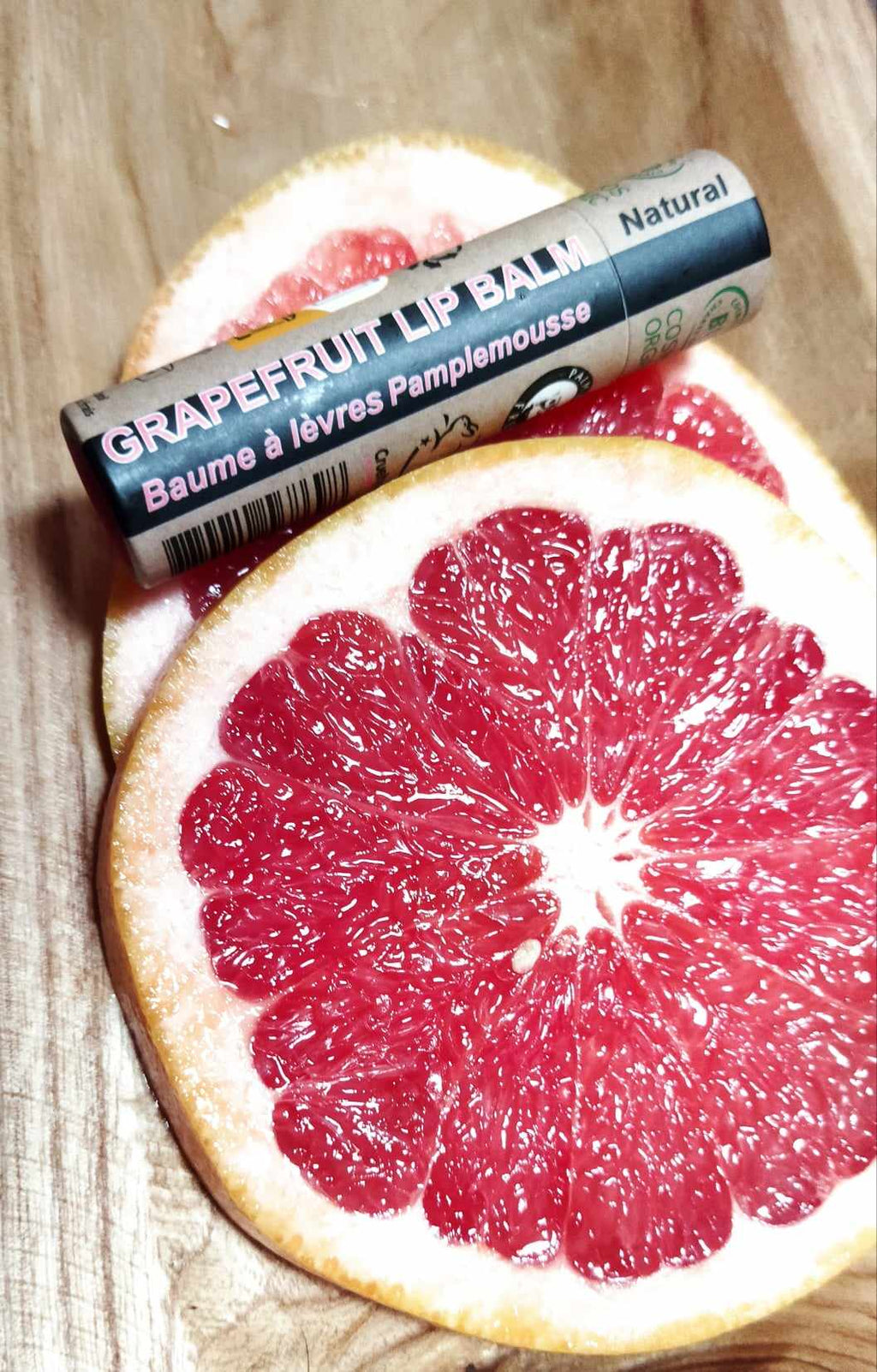 Organic pink grapefruit lip balm in eco-friendly push-up paper tube packaging — view 2
