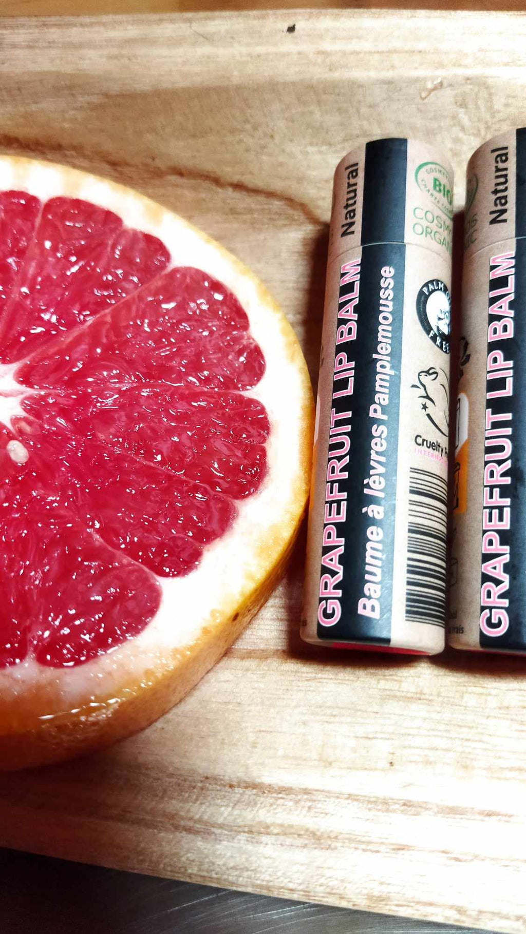 Organic pink grapefruit lip balm in eco-friendly push-up paper tube packaging — view 5