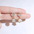 Cozy crystal swan drop earrings with delicate crystal-encrusted wings and dangle design