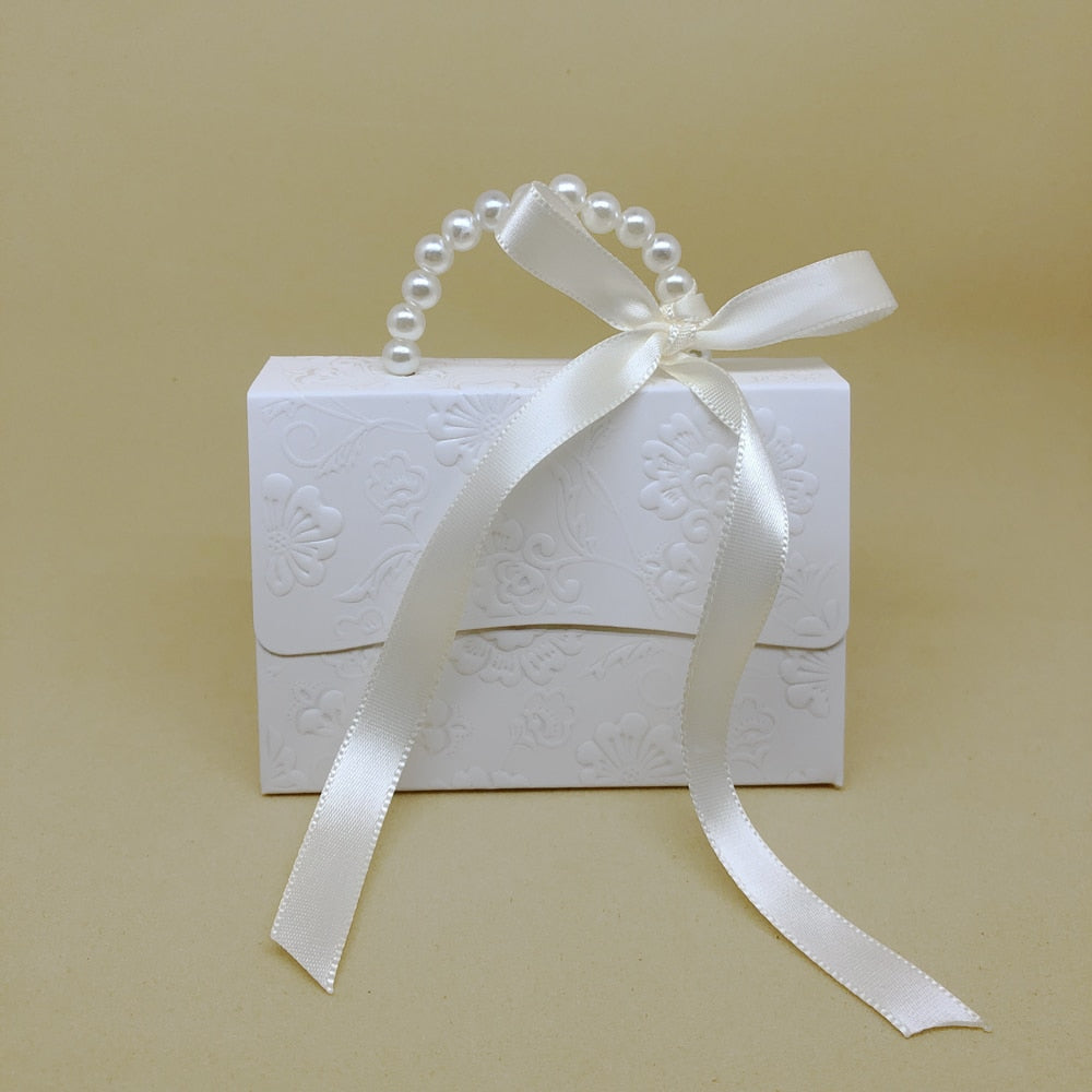 Marble pattern party favor gift boxes with faux pearl handles and decorative ribbons. — view 2