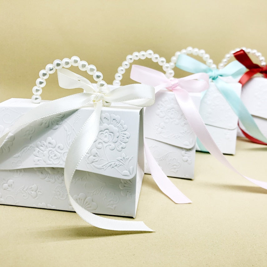 Marble pattern party favor gift boxes with faux pearl handles and decorative ribbons. — view 5
