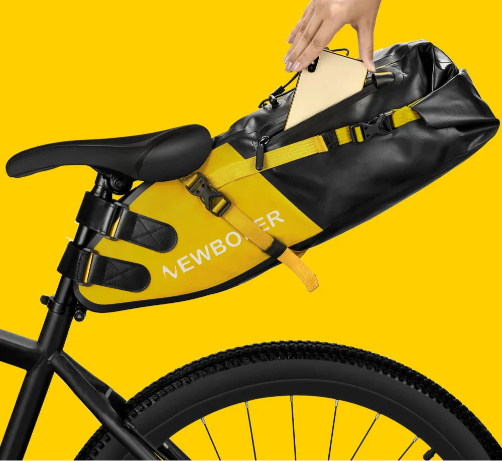 Waterproof 13L bike saddle bag in yellow PVC, mounted securely to a bicycle seat post — view 2