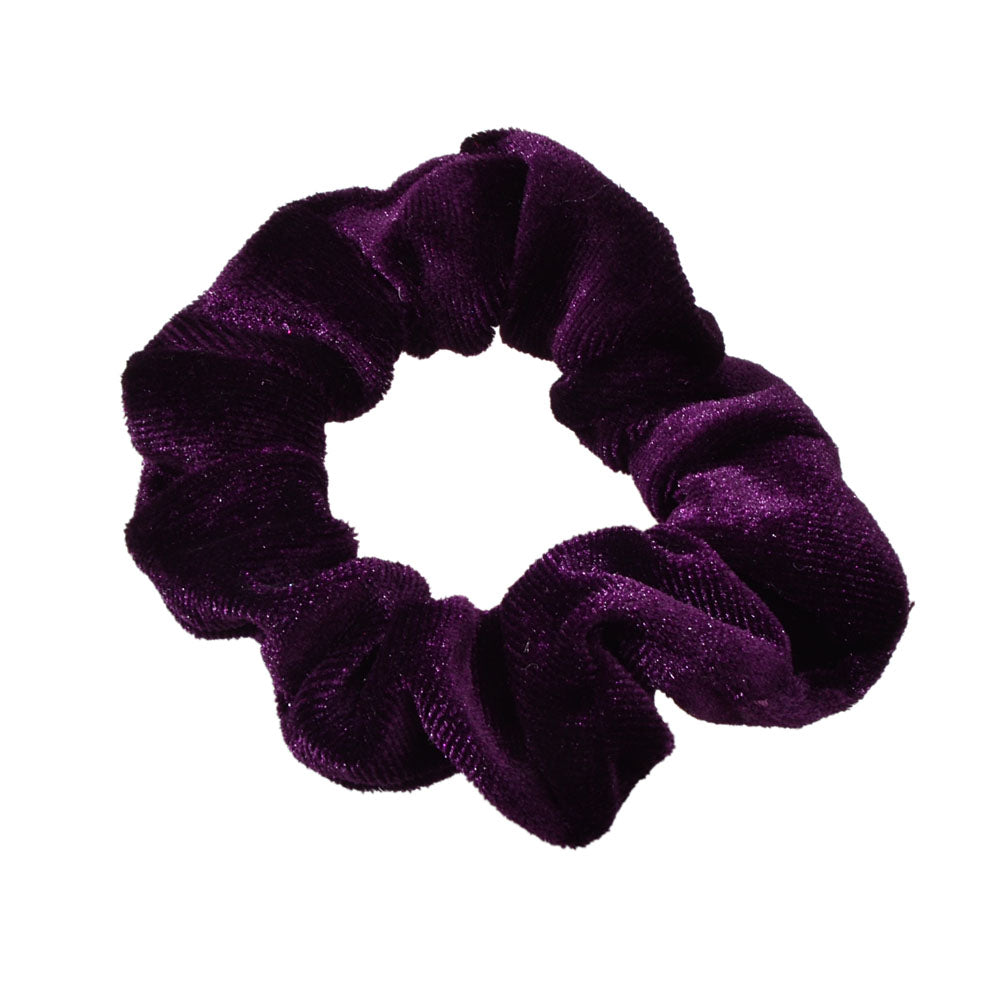 Retro velvet elastic scrunchie hair tie displaying soft fabric texture and flexible circular shape