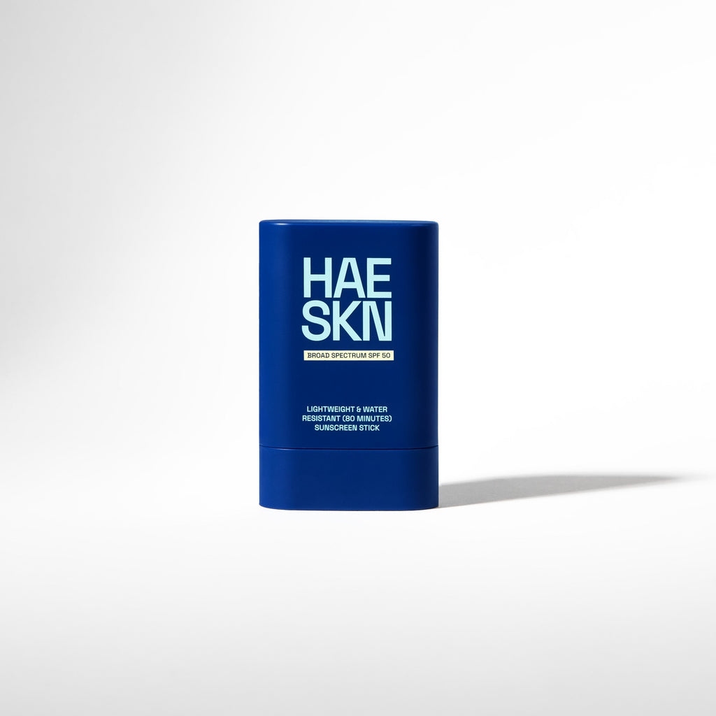 HAESKN SPF 50 sunscreen stick in a sleek, portable container for easy daily application.