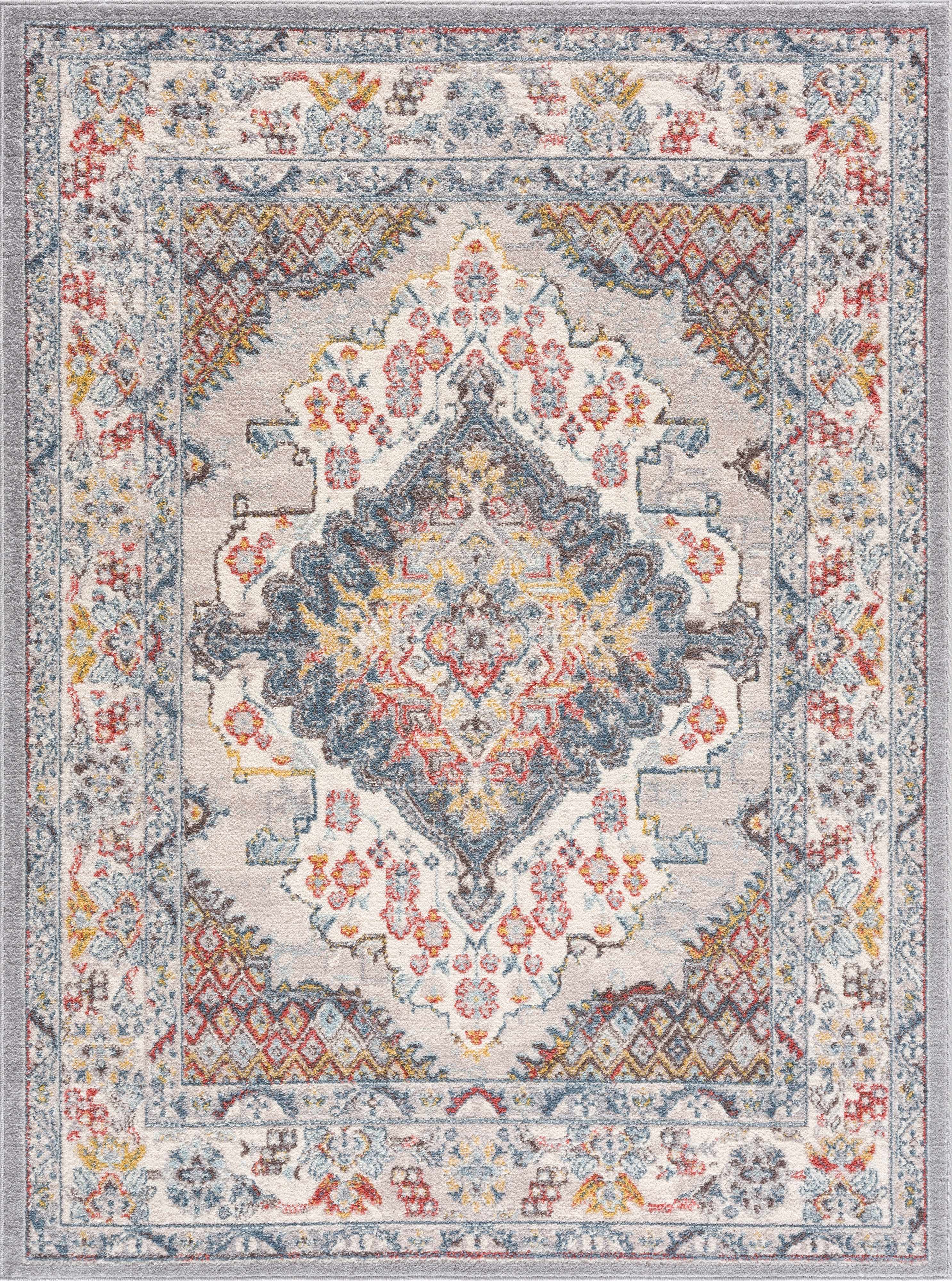 Haymond area rug featuring a traditional multi-color medallion pattern in taupe, blue, and red.