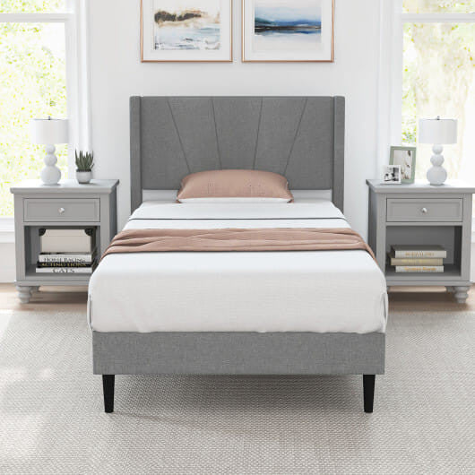Twin wingback bed frame in linen upholstery with quilted headboard and sturdy solid wood legs — view 6