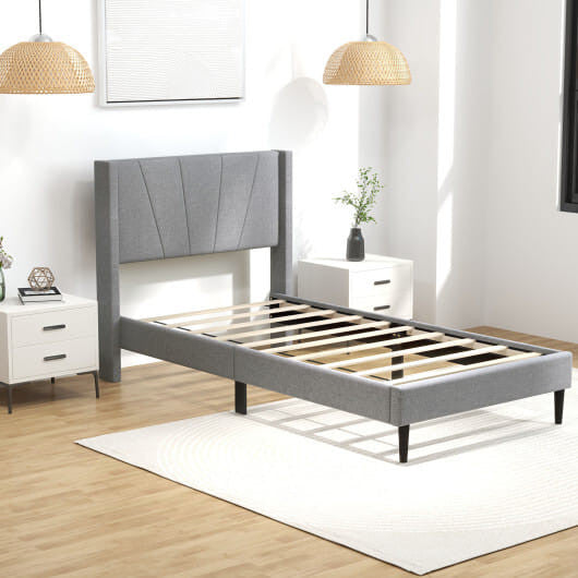 Twin wingback bed frame in linen upholstery with quilted headboard and sturdy solid wood legs — view 7