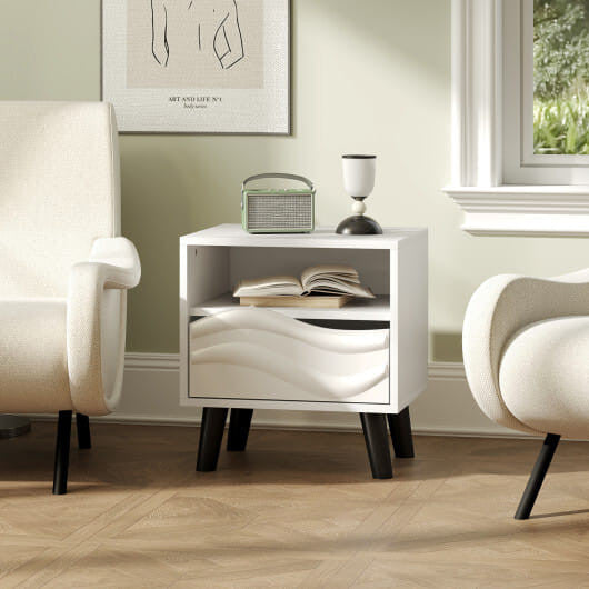 White mid-century modern nightstand featuring a 3D wavy drawer, open shelf, and tapered wooden legs