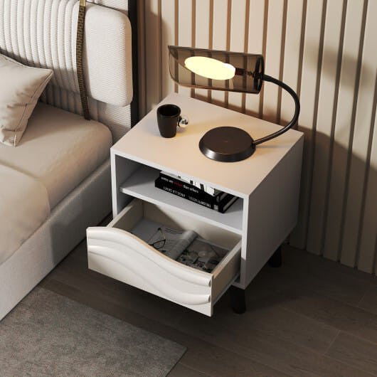 White mid-century modern nightstand featuring a 3D wavy drawer, open shelf, and tapered wooden legs — view 2