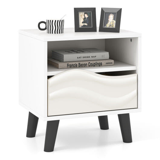 White mid-century modern nightstand featuring a 3D wavy drawer, open shelf, and tapered wooden legs — view 3