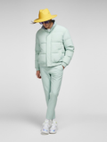 Men's mint green puffer jacket featuring a high collar, lightweight quilted fabric, and minimalist design.