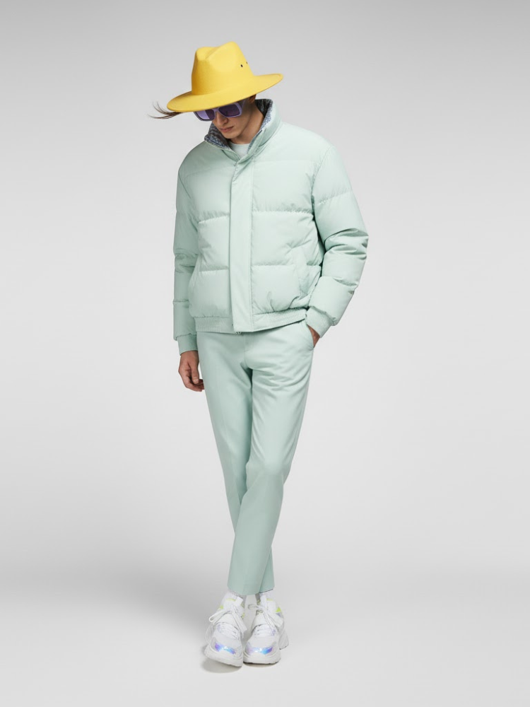 Men's mint green puffer jacket featuring a high collar, lightweight quilted fabric, and minimalist design.