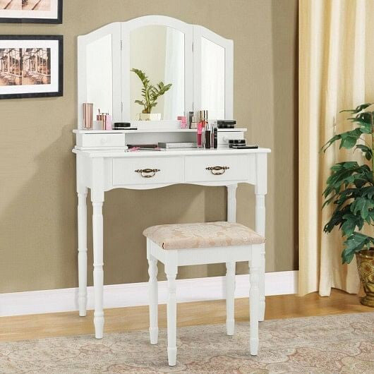White makeup vanity set with tri-fold mirror, four storage drawers, and cushioned floral seating stool — view 3