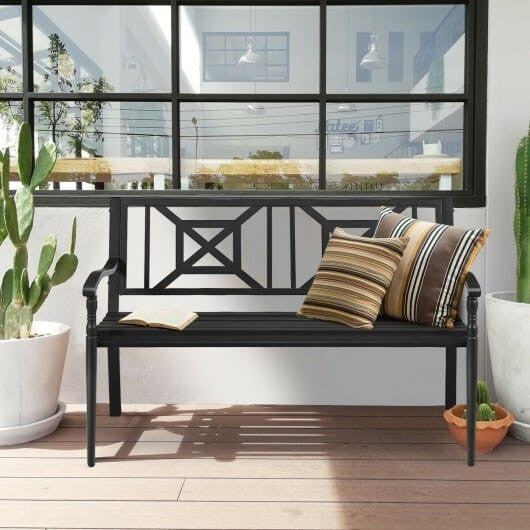 Black powder coated steel patio garden bench with elegant front legs and slatted backrest. — view 3