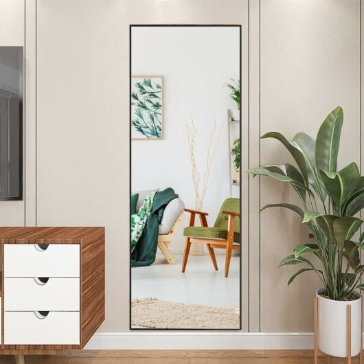59-inch full length golden mirror with aluminum frame leaning against a modern bedroom wall — view 2