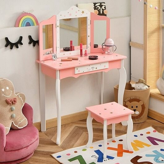 Pink kids princess vanity table and stool set featuring a tri-folding mirror and storage drawer