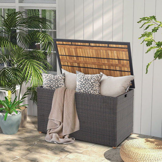 134 gallon brown rattan outdoor storage box with solid acacia wood top and elevated legs