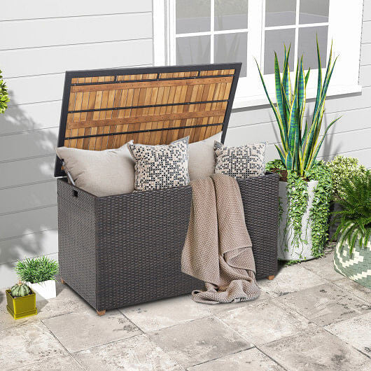 134 gallon brown rattan outdoor storage box with solid acacia wood top and elevated legs — view 2