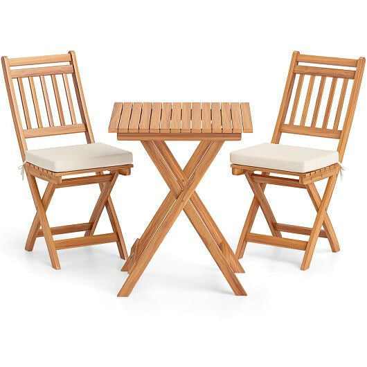 Acacia wood outdoor bistro set with folding table slatted chairs and soft white seat cushions — view 5