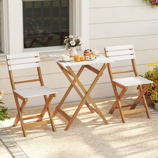 Acacia wood folding patio bistro set with two curved chairs and a square outdoor table
