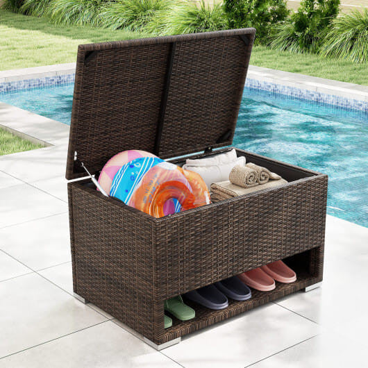 Brown PE rattan outdoor storage bin with waterproof liner and open lid on a patio. — view 2