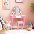 Pink kids vanity table and stool set featuring a rotating round mirror and storage drawer