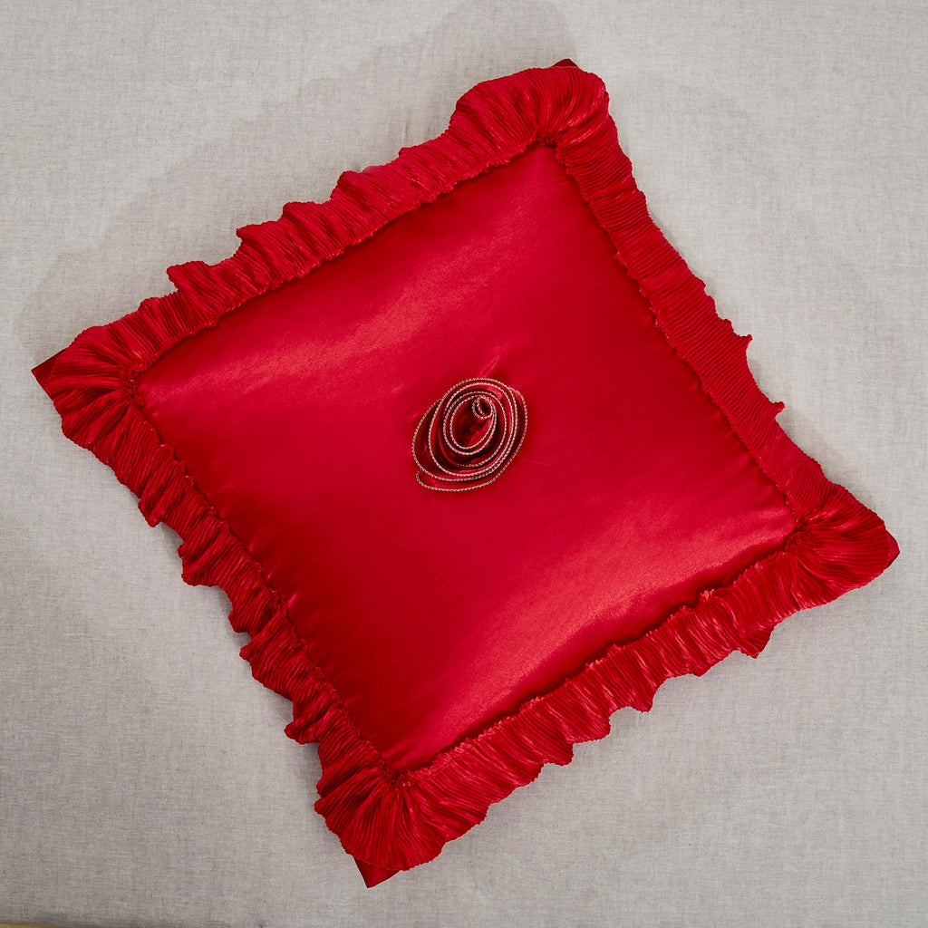 Bright red satin ruffled Euro pillow sham with floral embellishments and vintage ballroom design.