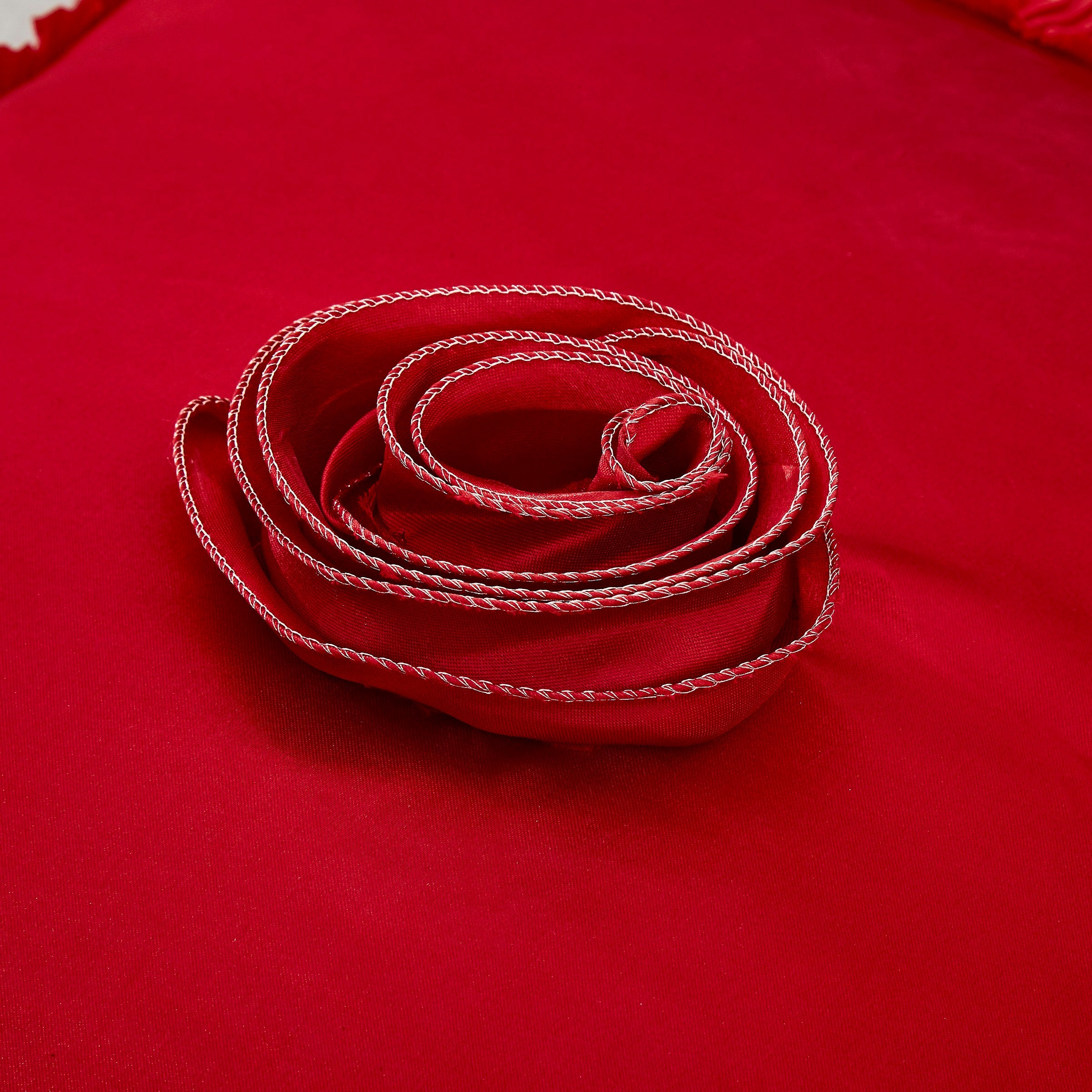 Bright red satin ruffled Euro pillow sham with floral embellishments and vintage ballroom design. — view 3