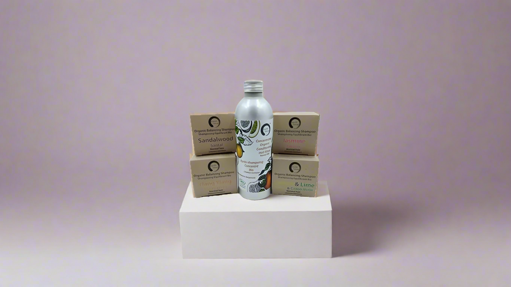 Organic hair care trio gift set with solid shampoo, concentrated rinse, and argan oil bottle