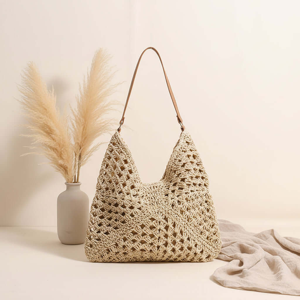 Large handmade crochet beach bag with woven hollow out triangle design and shoulder strap — view 2