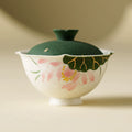 Handmade ceramic gaiwan with green lid and hand-painted pink lotus flower motif