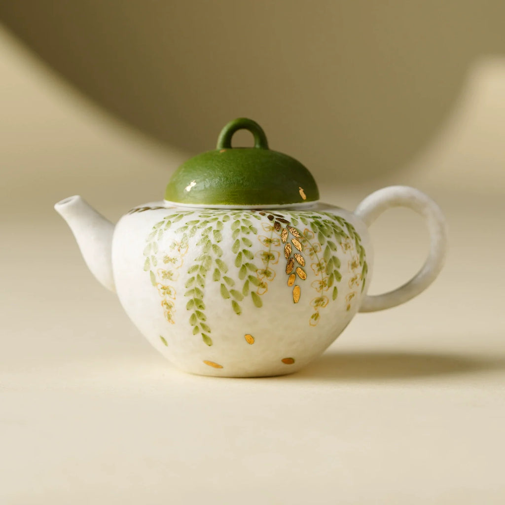 Handmade ceramic green leaf teapot with dome lid and loop handle for traditional tea ceremonies