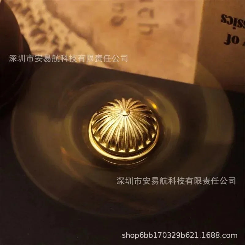 Golden Snitch metal fidget spinner in brilliant gold finish for stress relief and anxiety reduction — view 4