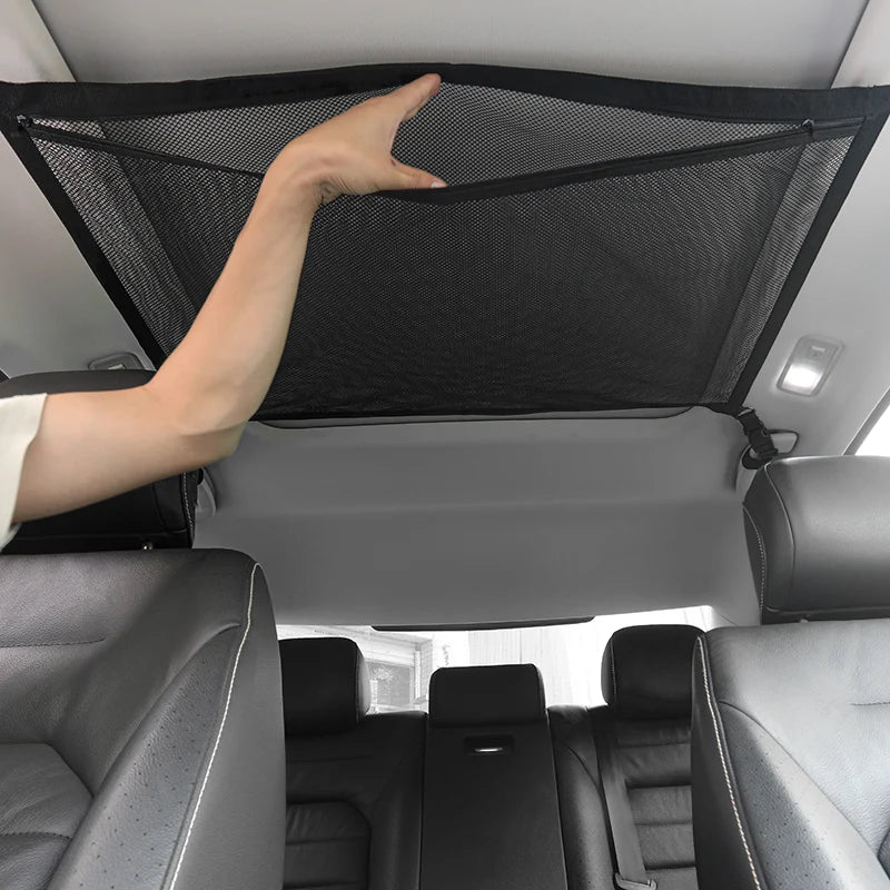 Black SUV ceiling storage net cargo organizer made of breathable mesh with adjustable attachment buckles — view 2