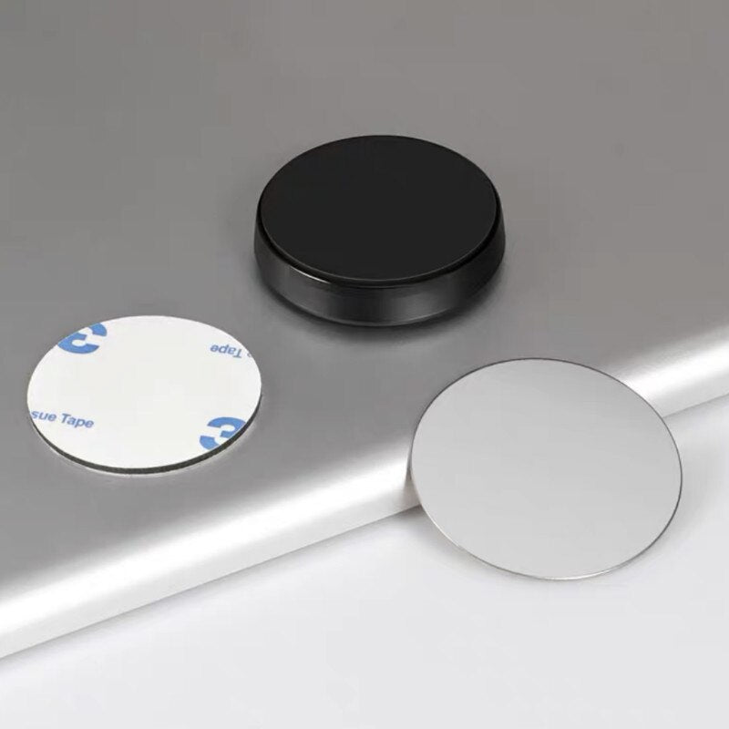 Universal magnetic phone mount in black aluminum alloy on a car dashboard — view 2