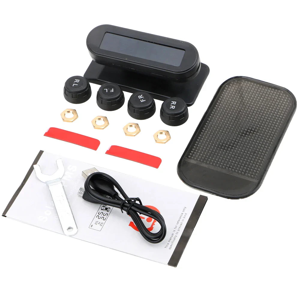 Solar wireless tire pressure monitor with black LCD display and four external waterproof sensors.