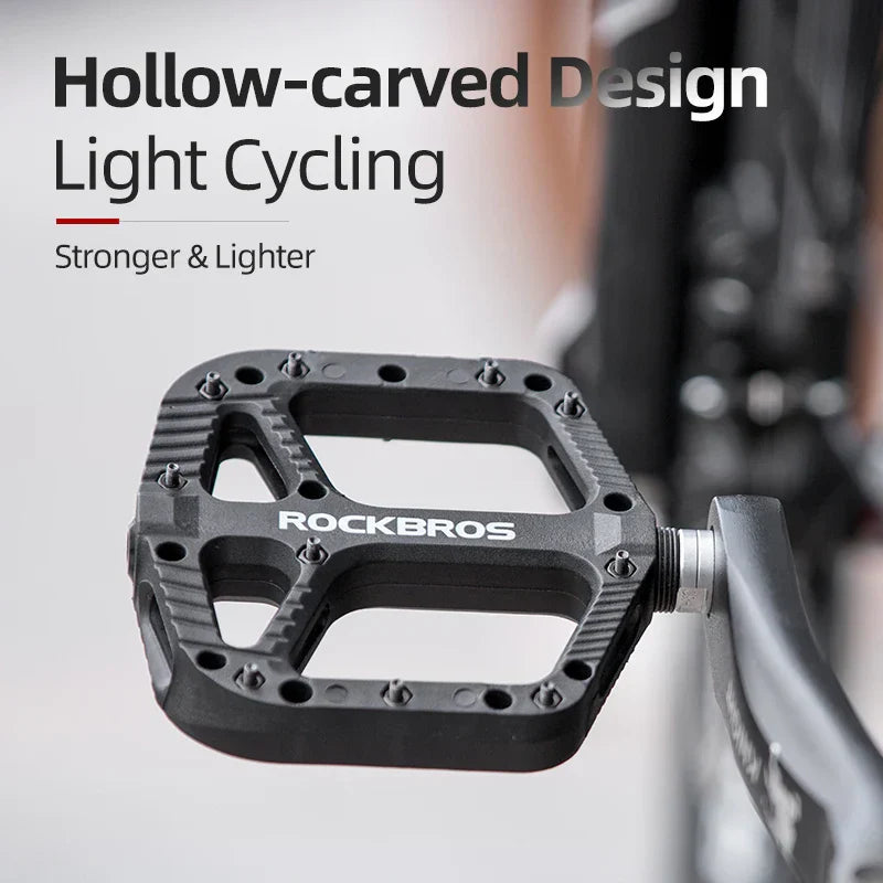 Black ultralight flat platform bicycle pedals made of nylon composite with anti-skid traction pins — view 4